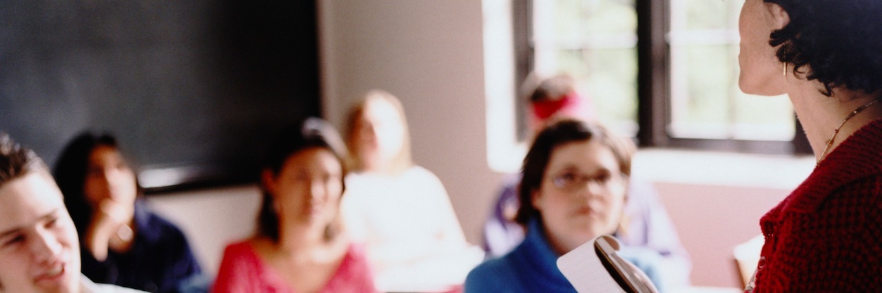 Mental Illness: A Thank You Letter to My Professors teacher in a classroom full of students