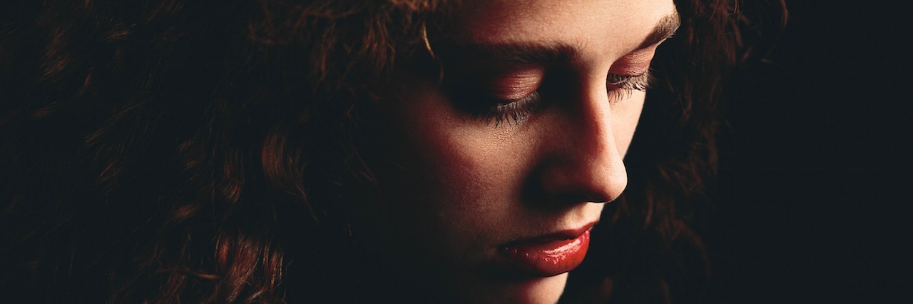 Feeling Shame and Guilt in Your Life With Mental Illness woman looking down