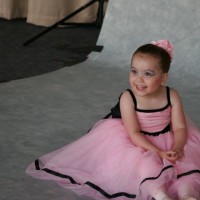 little girl with cerebral palsy in a ballerina costume