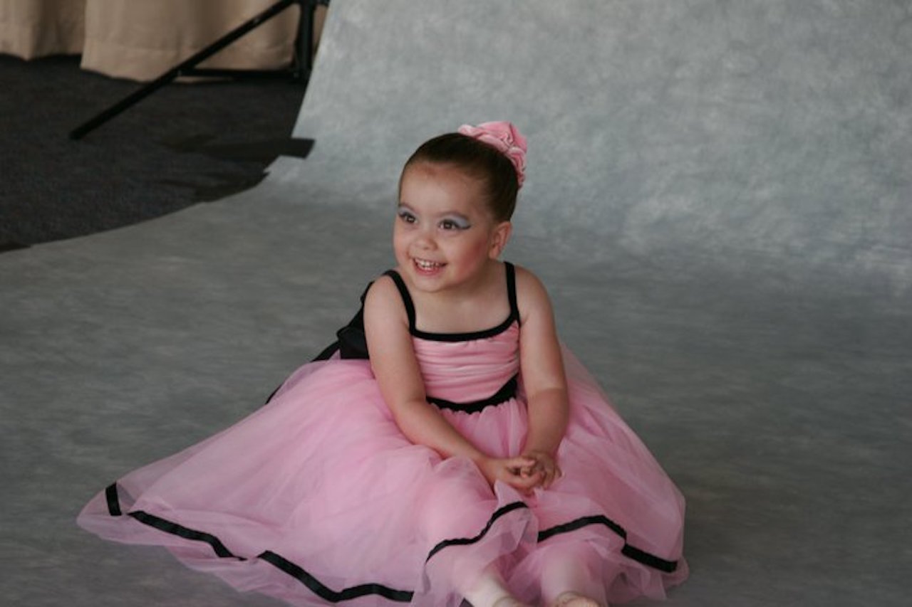 little girl with cerebral palsy in a ballerina costume