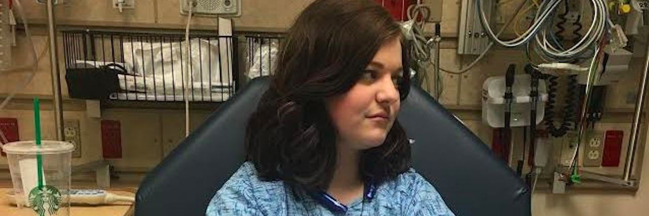 Is It Scary to Live With Chronic Diseases woman sitting in hospital gown in chair