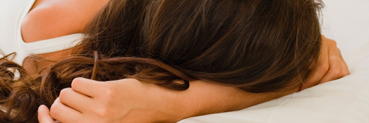 Diagnosis of Hashimoto's Thyroiditis and Feeling Tired Woman lying in bed