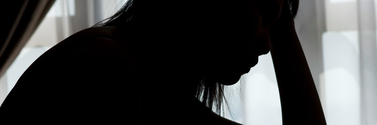 When I Got the Reed Procedure for Headache but Wasn't Cured of Pain Silhouette of a lady with hand on forehead