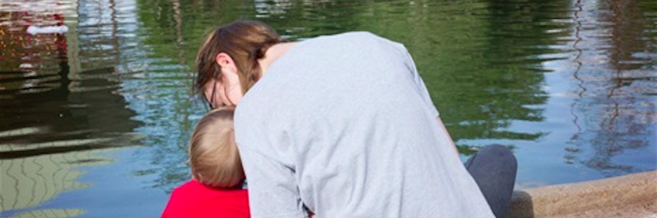 Learning to Follow Children on the Autism Spectrum mother and young son sitting by pond