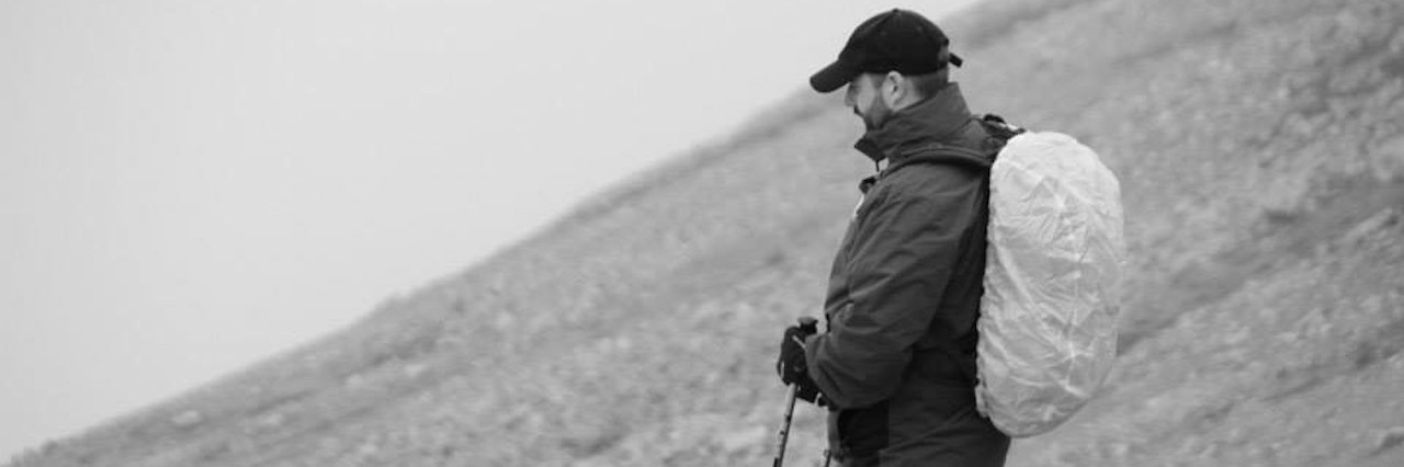 What It's Like Living With Vascular Ehlers-Danlos Syndrome black and white photo of man hiking on mountain