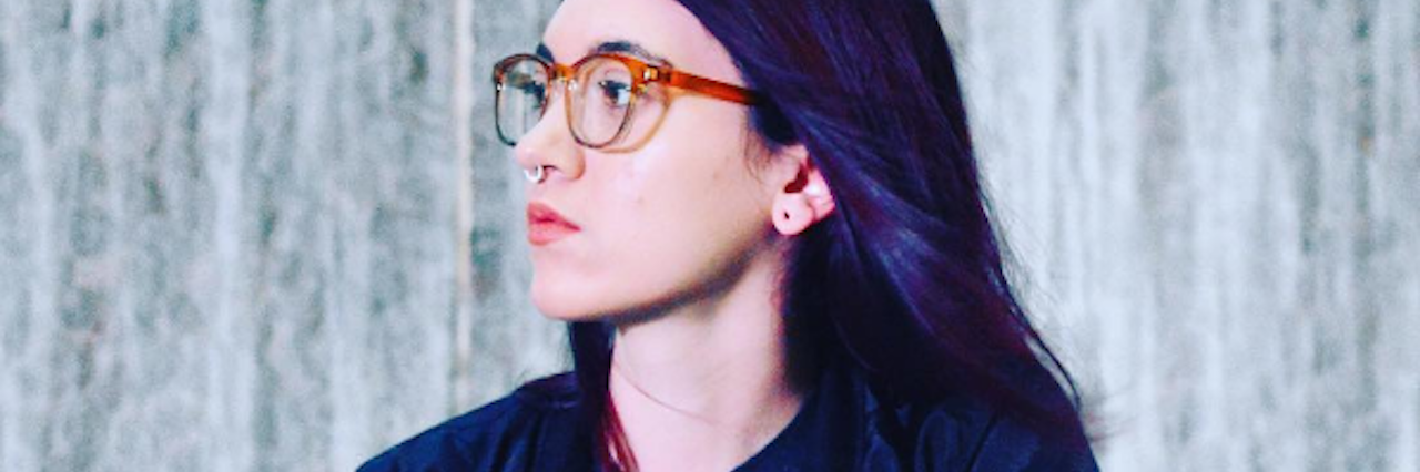 How Multiple Sclerosis Changed My Life and Made Me a Better Person photo of woman wearing dark jacket and glasses and looking into distance