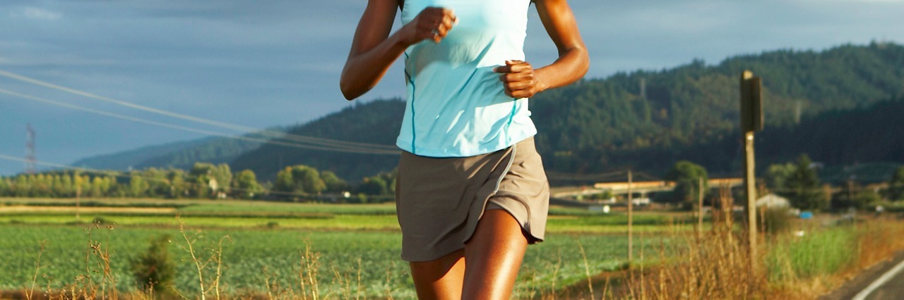 How I Stay Motivated to Stay Healthy With Diabetes woman jogging on path outside