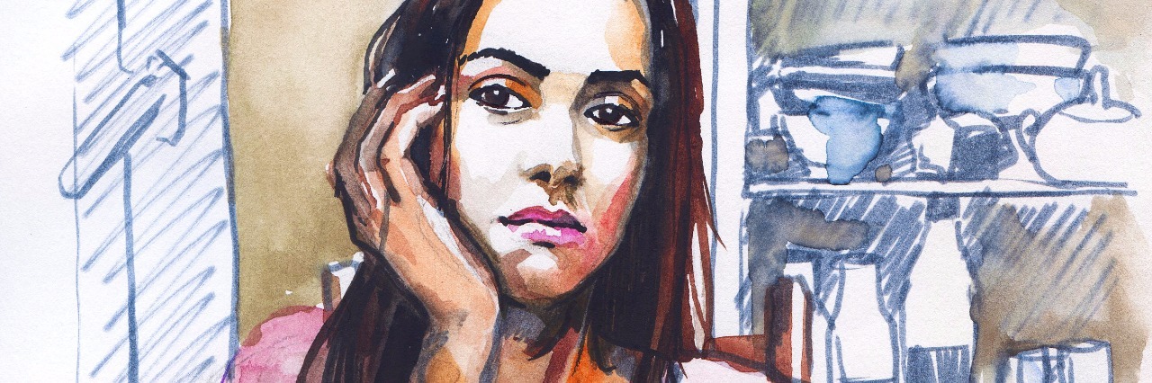 Emotional Symptoms of Having a Disease That Doesn't Go Away woman sitting at kitchen table with chin on hand