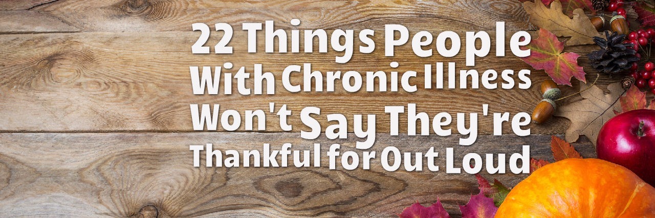 wooden background with fall leaves and pumpkin and words 22 things people with chronic illness won't say they're thankful for out loud