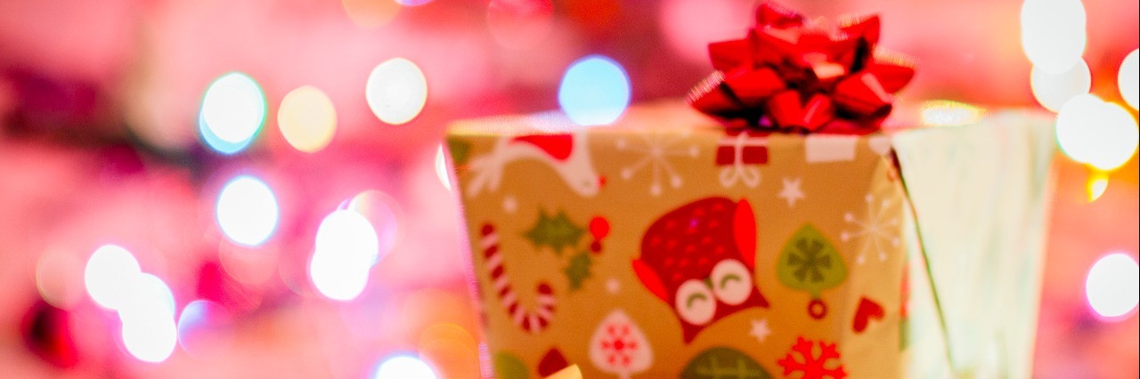 christmas presents wrapped with red and gold holiday paper