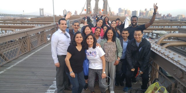 group of people standing on a bridge