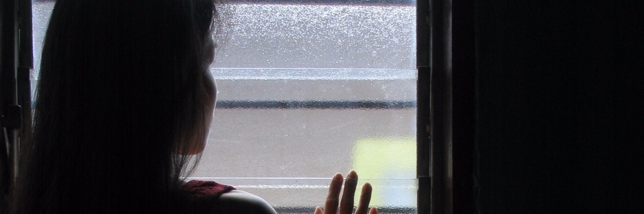 Fear of Missing Out and Being Sick silhouette of girl looking out window