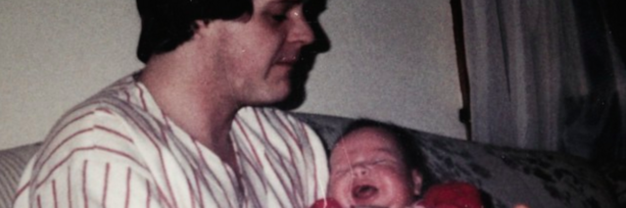 My Dad's Bipolar Disorder Story an old photo of the author as a baby and her father