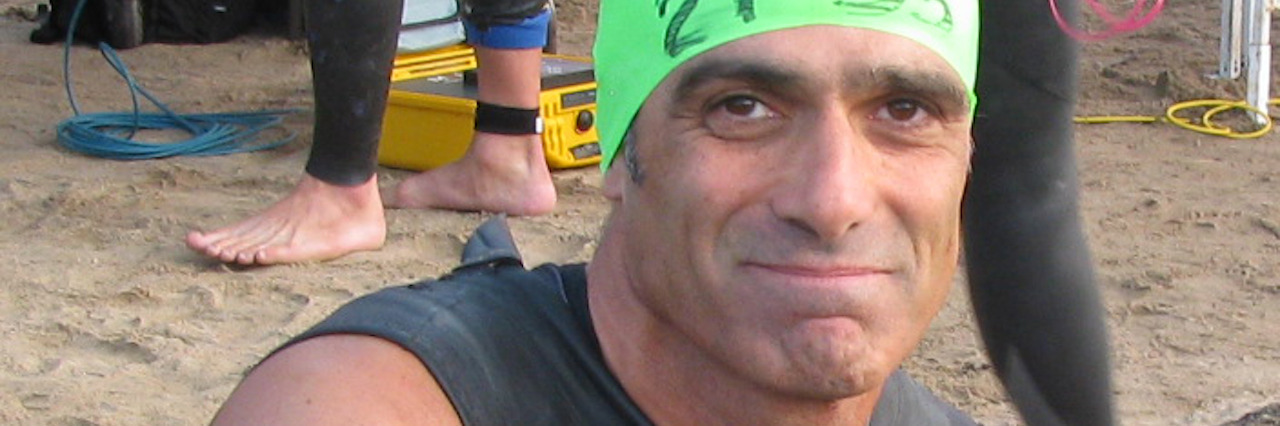 'Slipped Away': A Memoir About My Husband Who Died by Suicide A man in a wetsuit