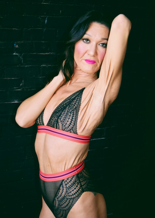 sara guerts modeling in a black and pink bikini