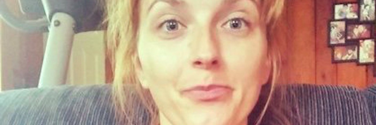 Stranger Gets to Decide If You’re Disabled woman with her cat