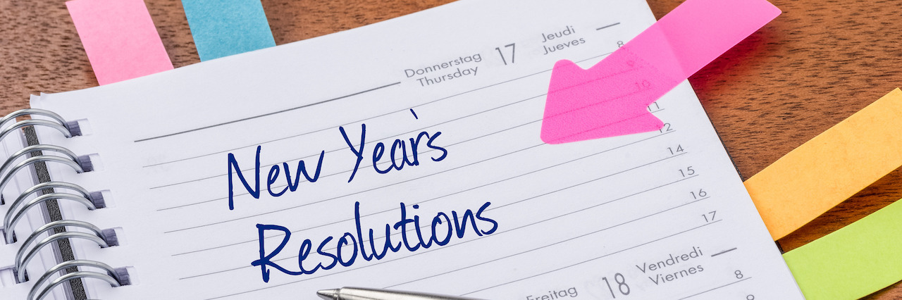 4 New Year's Resolutions for People in Eating Disorder Recovery Daily planner with the entry New Years Resolutions