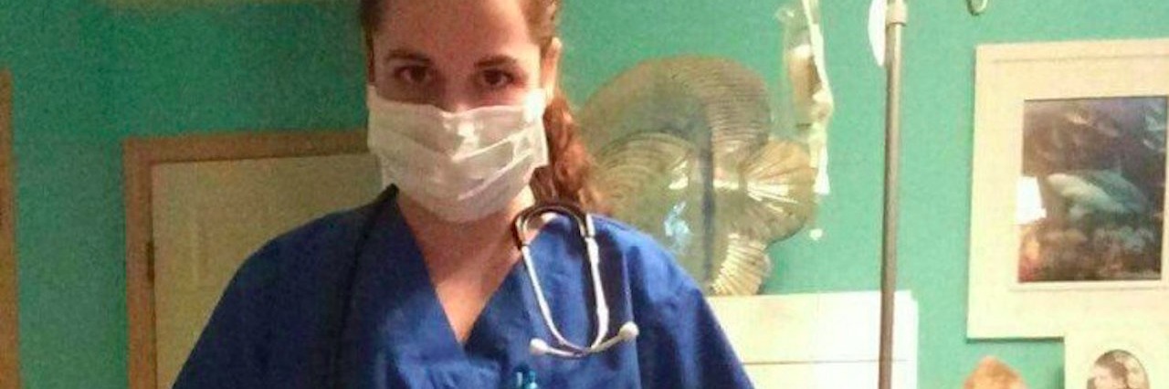 physician’s assistant wearing scrubs