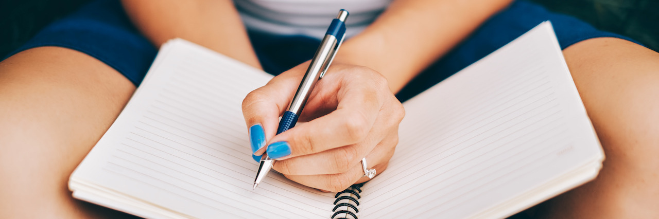 Letter to Depression When It Returns Notebook on women's hand