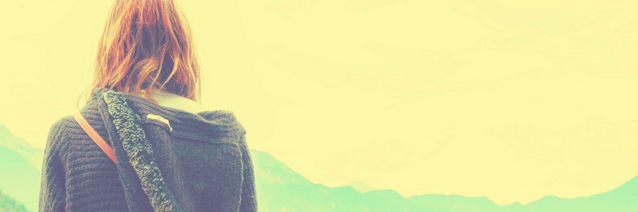 Tips on How to Deal With Chronic Pain as a Young Adult young woman sitting on a wooden pier