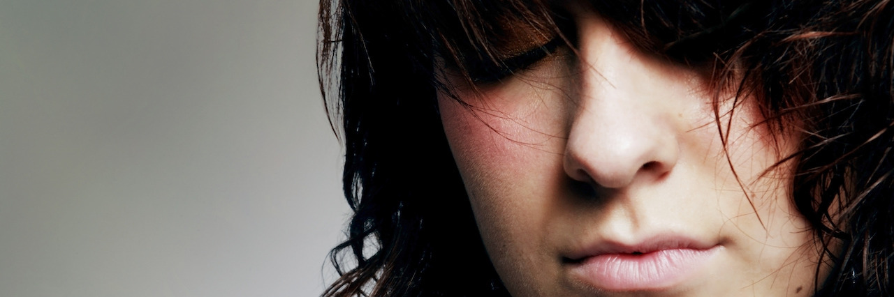 What It Feels Like When You Want to Self-Harm Woman with her eyes closed