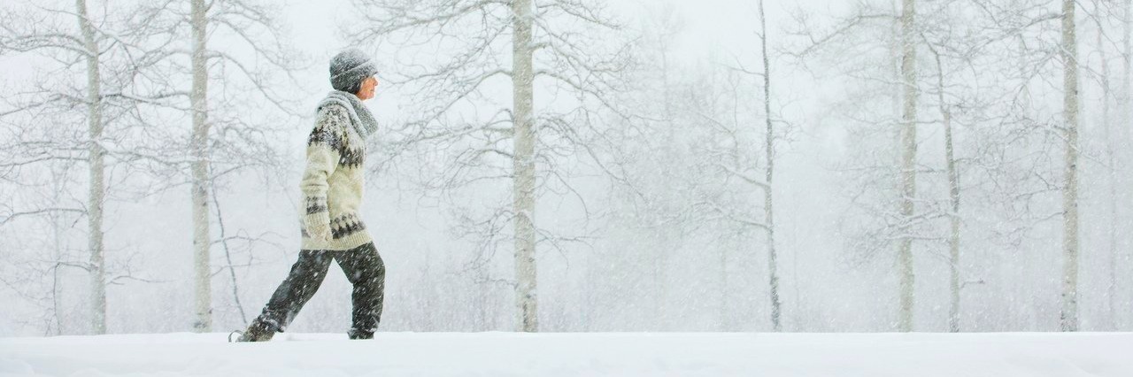 Gastroparesis: Things I’m Thankful for This Holiday Season woman walking through the snow