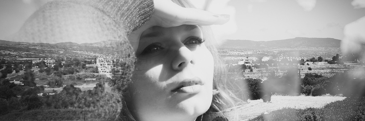 Bipolar Disorder: Why My 'Happy Days' Make Me Sad Woman portrait combined with mountain view, double exposure effect