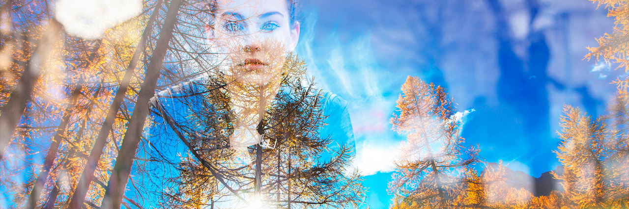 Double exposure of beautiful girl and autumn landscape
