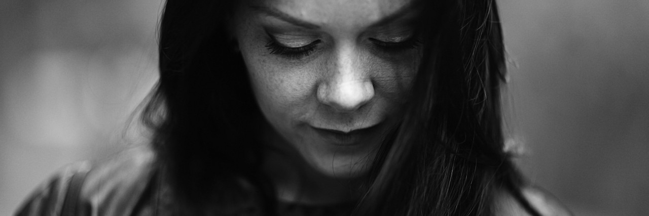 The Problem With People Commenting on My Weight black and white portrait of a young woman looking down