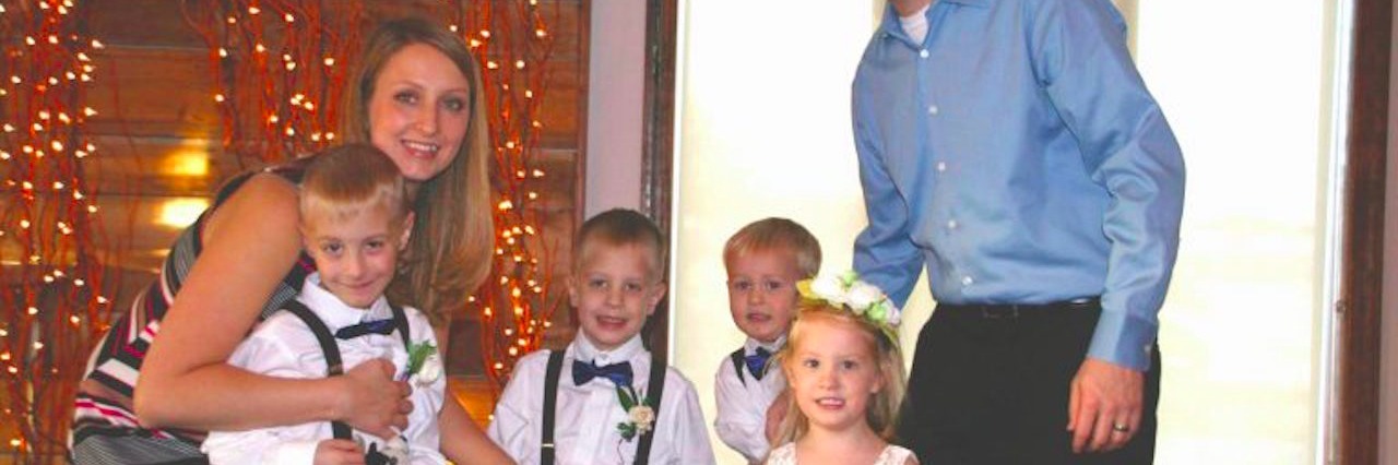 Holiday Outings With My Special Needs Family: 10 Things to Know family with mother father three sons and a daughter dressed up at a wedding