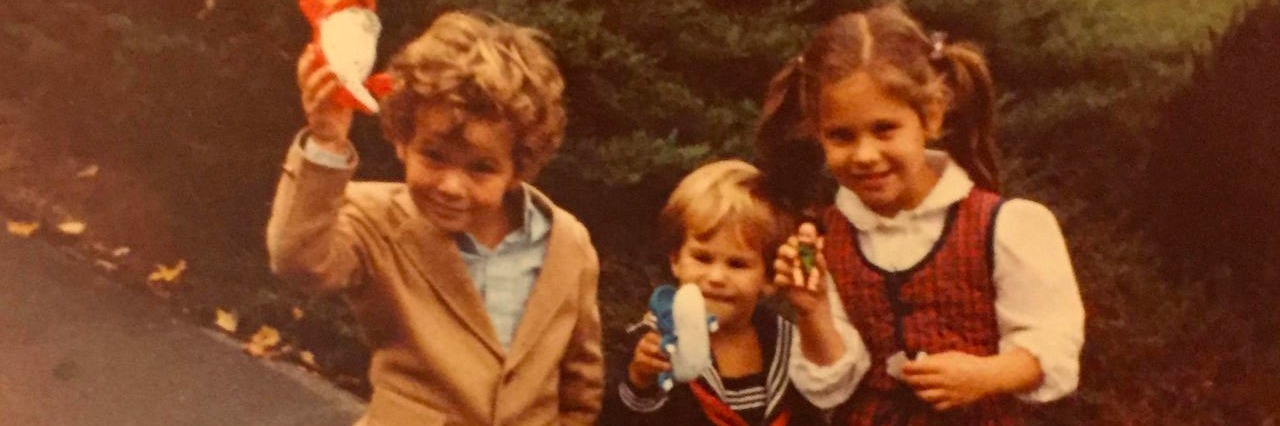 an old picture of the author and her two little brothers