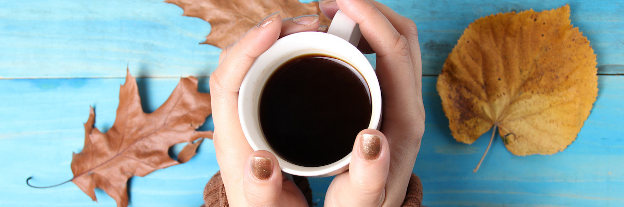 Focusing on the Positives in Life With Mental Illness Woman hands holding cup of coffee