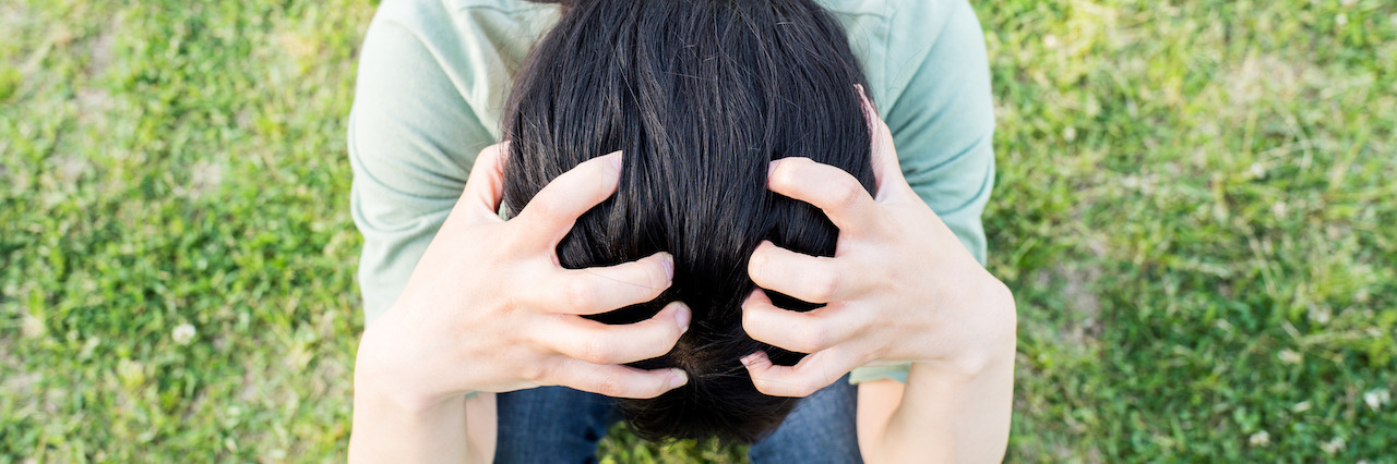 Experiencing 'Liminal Space' Before a Panic Attack Aerial view of depressed woman with hands in hair