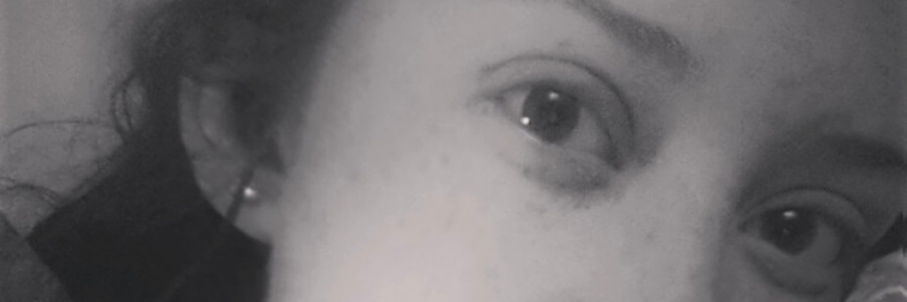 What ‘I’m Tired’ Means for People With Mental Illness closeup of a girls face lying in a bed