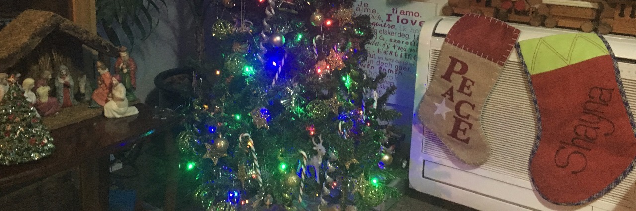 Coping With Grief During Christmas After Child Loss christmas tree and two stockings in a living room
