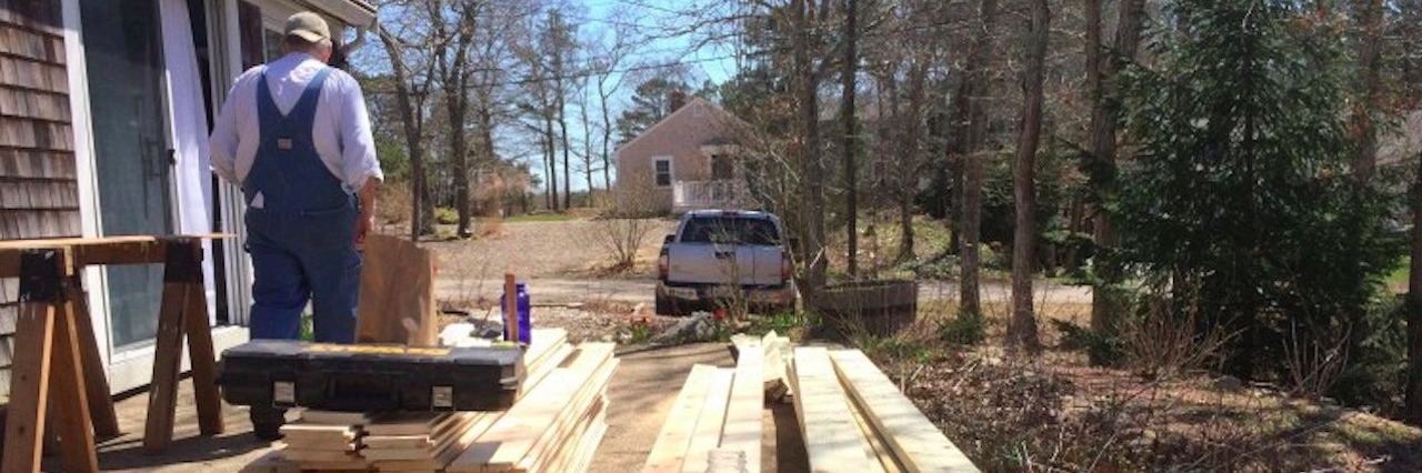 Rebuilding My Life After a Fibromyalgia Diagnosis man building addition to house