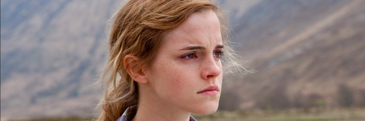 How Mental Illness Is Like the Troll from 'Harry Potter' A side view of a young woman with a mountain in the background