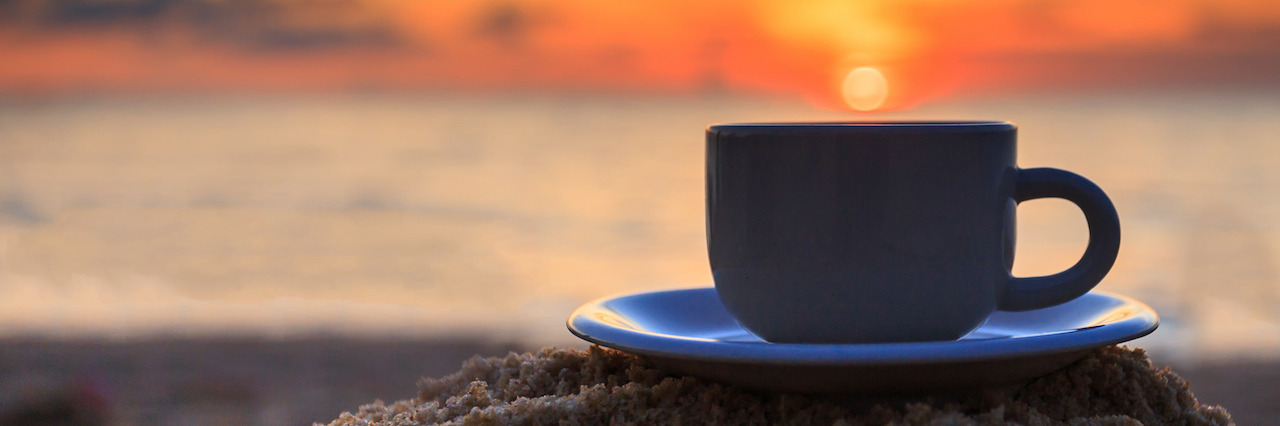 Coffee cup and sunset