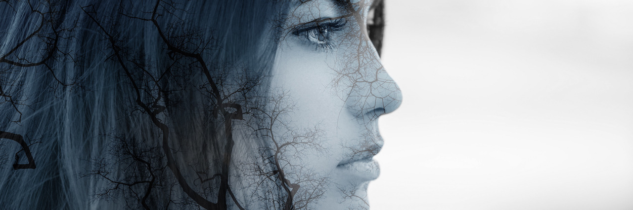 Accepting the Realities of Life With Mental Illness Girl in profile. Double exposure of young woman and forest.