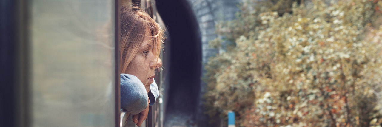 Depressed young woman in the train