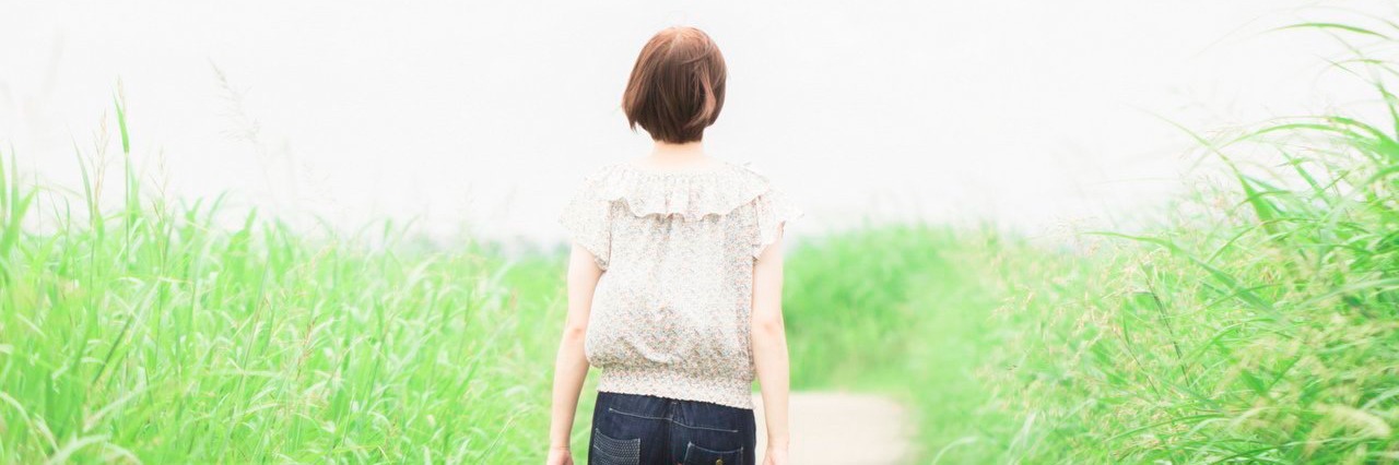 Chronic Pain: Doing Something Productive Boosts My Self-Esteem woman in the countryside