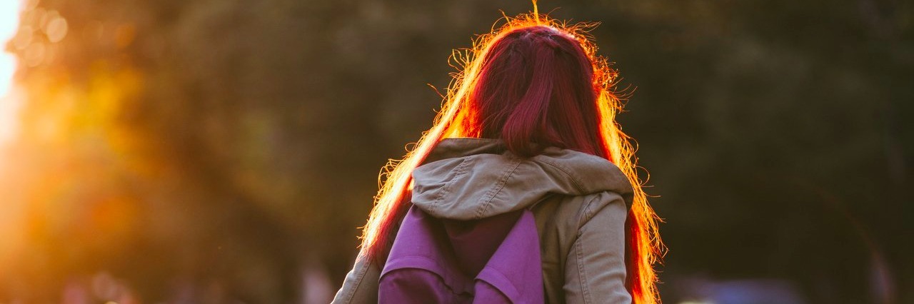 Young Person’s Guide to Navigating Chronic Pain student waiting for public transportation