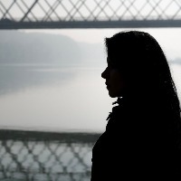woman looking at a bridge