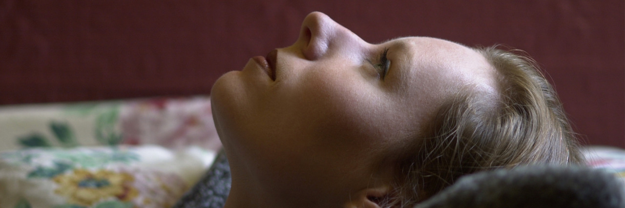 What It's Like After a Suicide Attempt A woman lying down staring at the ceiling