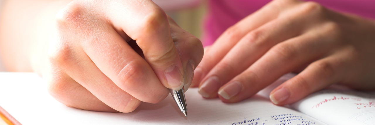 A Letter to My Depression That I Am Breaking Up With Young female is writing in a journal