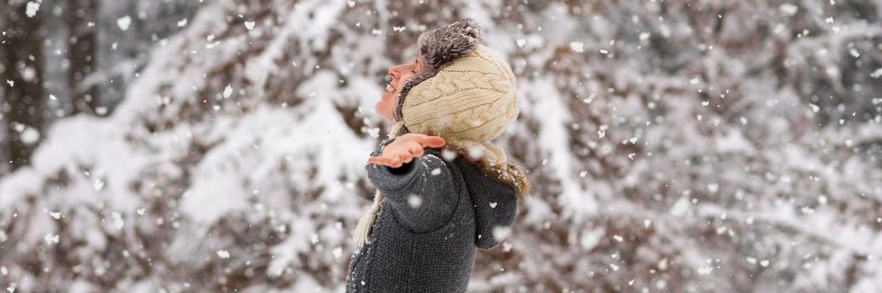 Woman Wishes Visibility for People With Invisible Illnesses woman standing in the middle of a snowy woodland