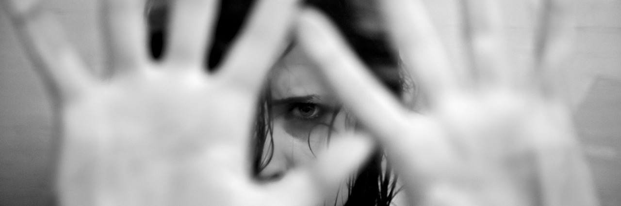 PTSD: What It Feels Like to Have a Flashback Sad woman scared putting hands in front of face