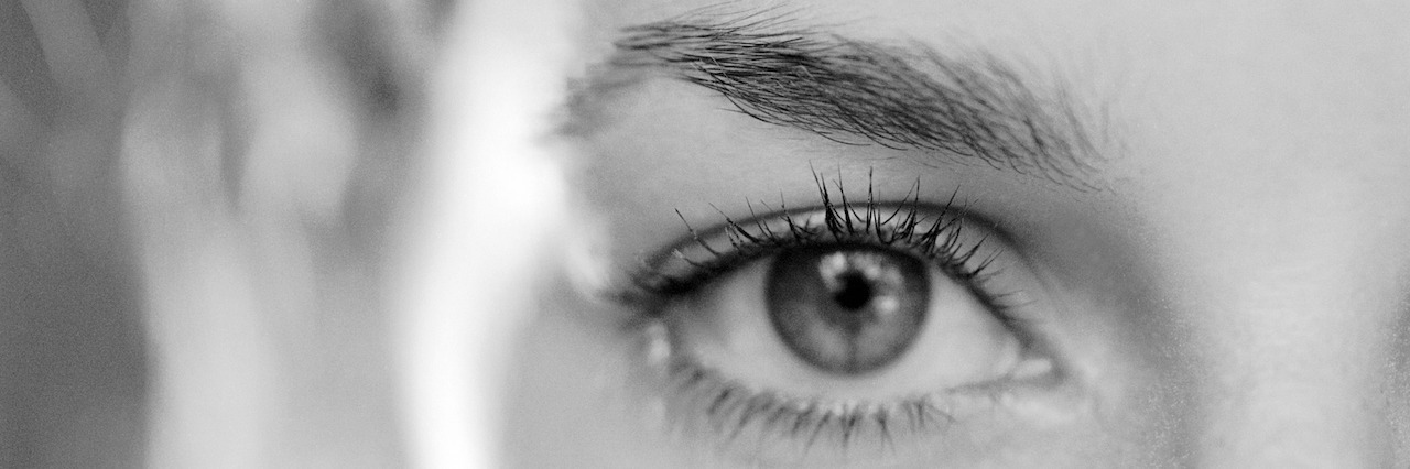 What It's Like Living With Hidden Depression No One Knows About Close-up of woman's eye