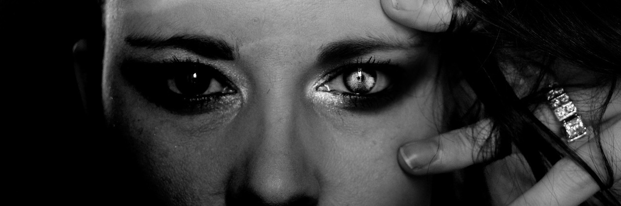 Borderline Personality Disorder: Life After Multiple Suicide Attempts dark portrait of young woman wearing makeup looking at camera