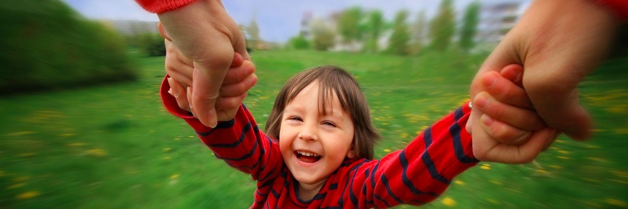 I Won’t Accept Lupus, but I’ll Accept the Battle woman spinning a child while holding his hands
